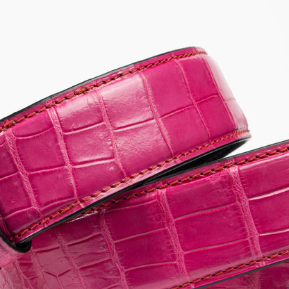 detail of pink alligator belt for men 