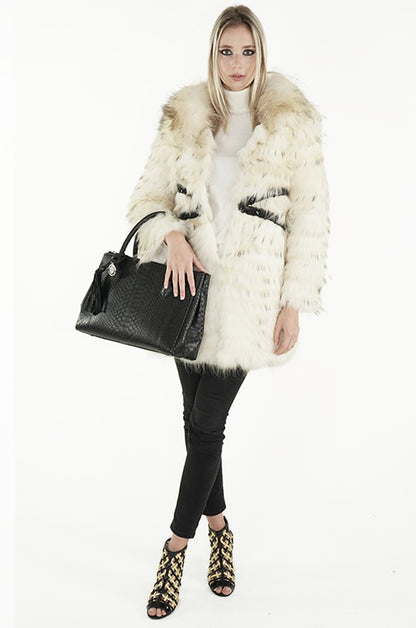 blonde model wearing a fur coat and carrying the sherrill brothers black python tote bag  