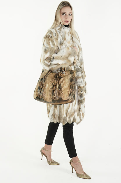 Model with brown python hobo handbag and fur coat from sherrill bros