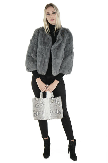 woman with gray python tote bag and gray fur coat from Sherrill Bros